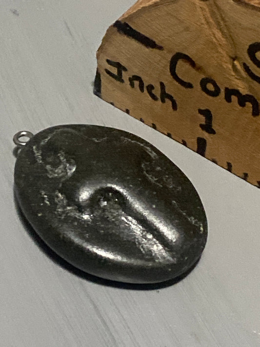 Hand carved stone pendant/charm